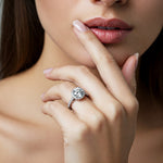 Ariana - diamond halo engagement ring on a hand